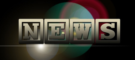 NEWS - Buchstaben in quadratischem Rahmen vor bunten Kreisen